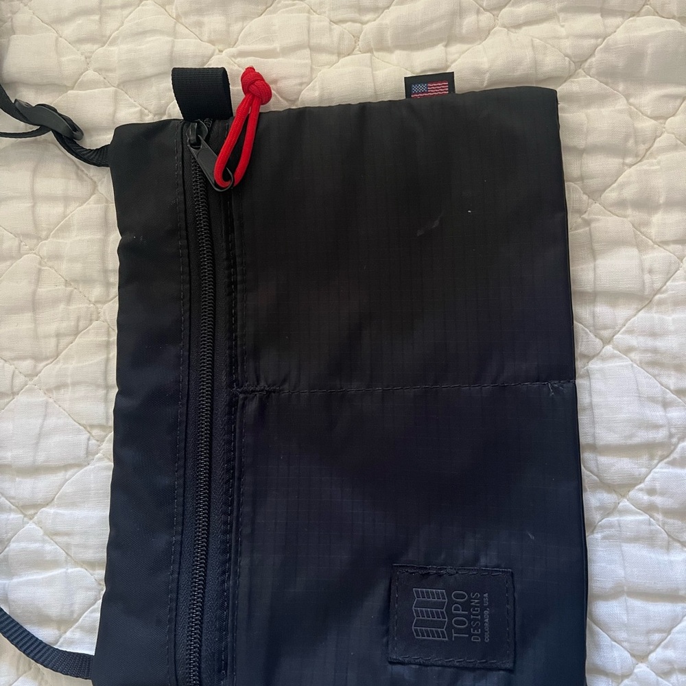 Topo Designs Black Messenger Bag with Red Accent